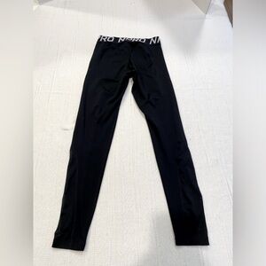Nike Pro Leggings Size M with mesh insert on legs.